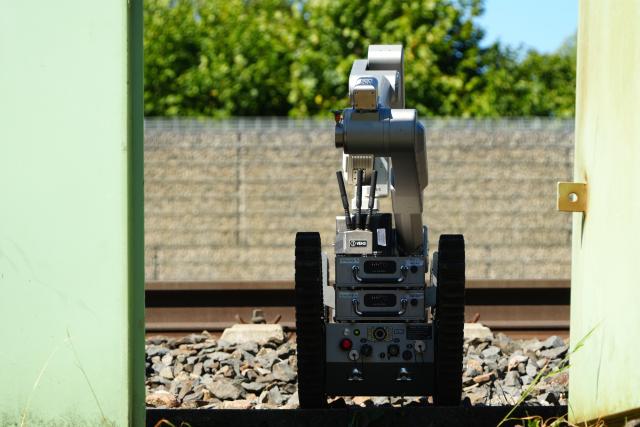 13 August 2026, Bavaria, Treuchtlingen: A bomb-disposal robot is being deployed at a train station in Middle Franconia. Special forces from the Federal Police are examining an object suspected of containing explosives. A police spokesperson said a technician had discovered the object in the track bed at the entrance to the city's train station. Photo: Felix Kirberg/dpa