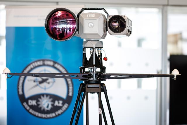 14 August 2026, Bavaria, Nuremberg: A high-performance day-night camera for verifying or visually detecting drones is on display at a press conference at Nuremberg Airport focused on drone detection and defense. To best prepare the Bavarian police for current and future developments in this area and to further expand existing capabilities, the Drone Competence and Defense Center (DKAZ) began operations in Erding on April 1, 2026. Photo: Daniel Karmann/dpa