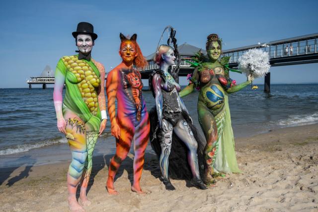 15 August 2026, Mecklenburg-Western Pomerania, Heringsdorf: Models showcase their bodies, painted by body painting artists, at the Body Painting Festival in the seaside resort on the island of Usedom. Photo: Stefan Sauer/dpa - ACHTUNG: Nur zur redaktionellen Verwendung im Zusammenhang mit der aktuellen Berichterstattung und nur mit vollständiger Nennung des vorstehenden Credits