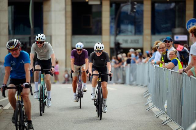 16 August 2026, Hamburg: Participants in the "ADAC Cyclassics" cycling event ride their road bikes along Jungfernstieg during the amateur race. Photo: Gregor Fischer/dpa