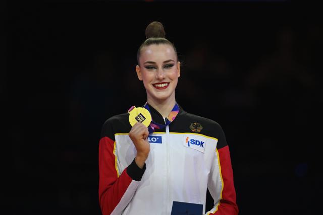 16 August 2026, Hesse, Frankfurt_Main: Germany's Darja Varfolomeev celebrates winning gold after the women's final of the World's Gymnastics Championships in Frankfurt am Main. Photo: Marijan Murat/dpa