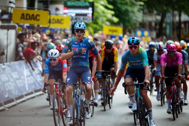 16 August 2026, Hamburg: French rider Paul Magnier of team Soudal Quick-Step reacts celebrates his victory after crossing the finish line of the men's UCI Cyclassics World Tour 205.3 km race. Photo: Gregor Fischer/dpa
