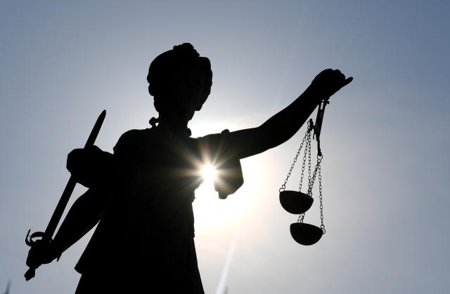 FILED - 25 February 2019, Frankfurt/Main: FILE PHOTO - A view of the statue of Justitia holding scales and a sword. Photo: Arne Dedert/dpa