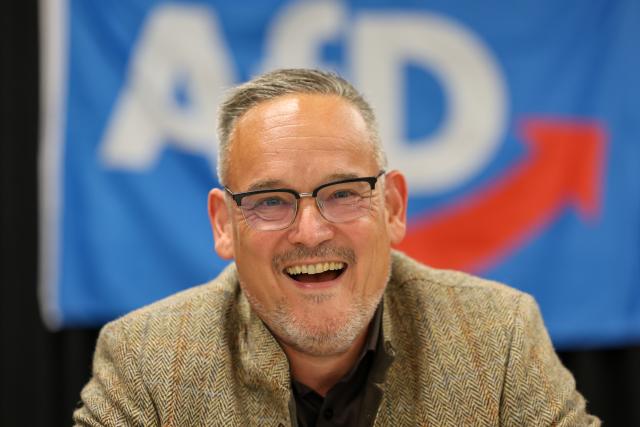 17 August 2026, Saxony-Anhalt, Weferlingen: Martin Reichardt, state chairman of the Alternative for Germany party in Saxony-Anhalt, attends an AfD town hall meeting in Weferlingen regarding the 2026 state election. Photo: Peter Gercke/dpa