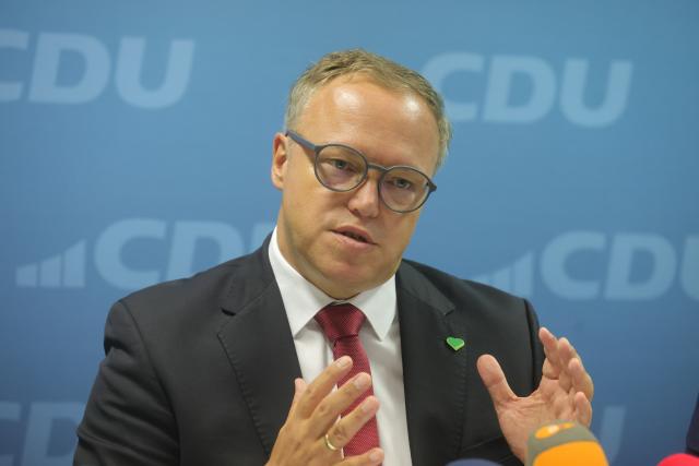 18 August 2026, Thuringia, Erfurt: Mario Voigt, Minister President of Thuringia, speaks at a press conference ahead of the CDU Thuringia state party convention on August 22 in Eisenach. Photo: Bodo Schackow/dpa