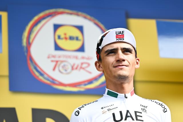 19 August 2026, Hesse, Bad Orb: Mexican cyclist Isaac Del Toro celebrates on the podium after winning the 2.6 km individual time trial during the 2026 Tour of Germany cycling race in Bad Orb. Photo: Florian Wiegand/dpa