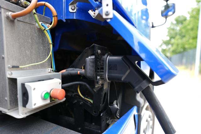 FILED - 11 August 2026, Hamburg: FILE PHOTO - An electric truck is being charged at a charging station on the grounds of the Bartels-Langness grocery store. Photo: Marcus Brandt/dpa