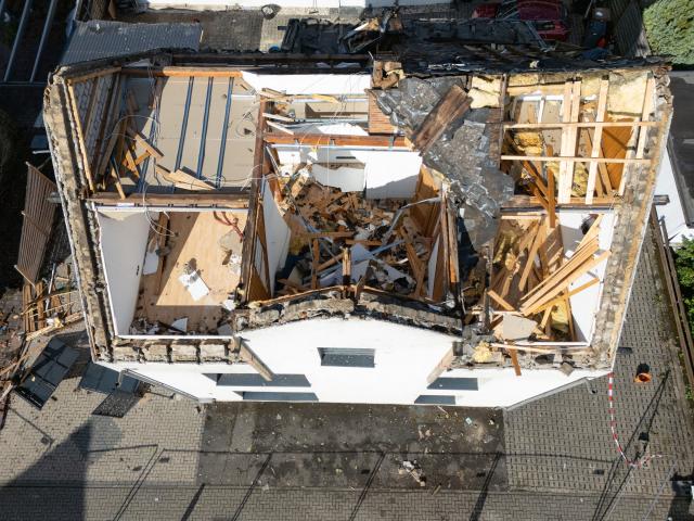 19 August 2026, Rhineland-Palatinate, Hoehr-Grenzhausen: A view of a damaged house, after a thunderstorm hit the area leaving several houses severely damaged. Photo: Boris Roessler/dpa