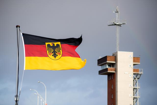 FILED - 22 December 2023, Lower Saxony, Wilhelmshaven: FILE PHOTO - A flag of the Federal Republic of Germany flies in the wind on board the frigate "Hessen" after arriving at the naval base in Lower Saxony. Naval vessels from five countries held an exercise south of the Cypriot port city of Limassol. Units from the German, Greek, US, Italian and Cypriot navies are taking part, Cyprus' National Guard said. Photo: Hauke-Christian Dittrich/dpa