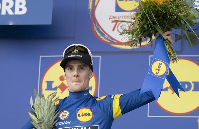 20 August 2026, Hesse, Schwaebisch Hall: French cyclist Louis Barre celebrates at the awards ceremony after the stage one of the 2026 Tour of Germany cycling race, 216.30 km from Bad Orb to Schwaebisch Hall. Photo: Marijan Murat/dpa