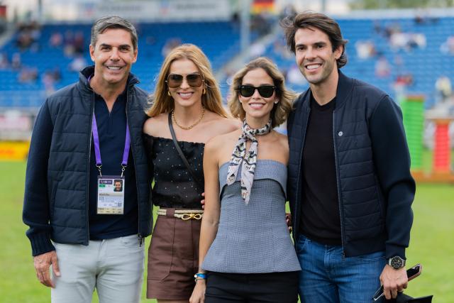 21 August 2026, North Rhine-Westphalia, Aachen: (L-R) Brazil's show jumping rider Alvaro Affonso de Miranda Neto, his wife Denize Severo, Carolina Dias, and former Brazilian soccer player Kaka pose for a photo during the second round of the Nations Cup, at the Equestrian World Championships Show Jumping event in Aachen. Photo: Rolf Vennenbernd/dpa