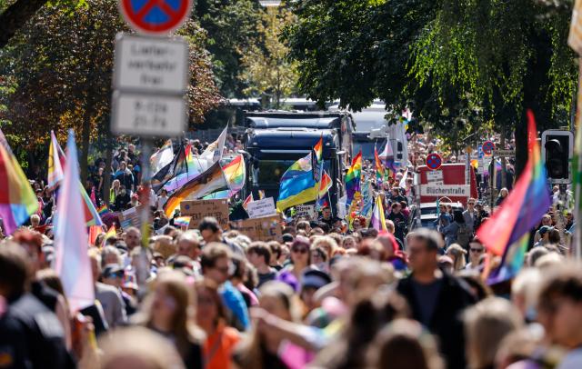 22 August 2026, Bremen: Participants in the Christopher Street Day (CSD) parade walk along Osterdeich. Photo: Focke Strangmann/dpa