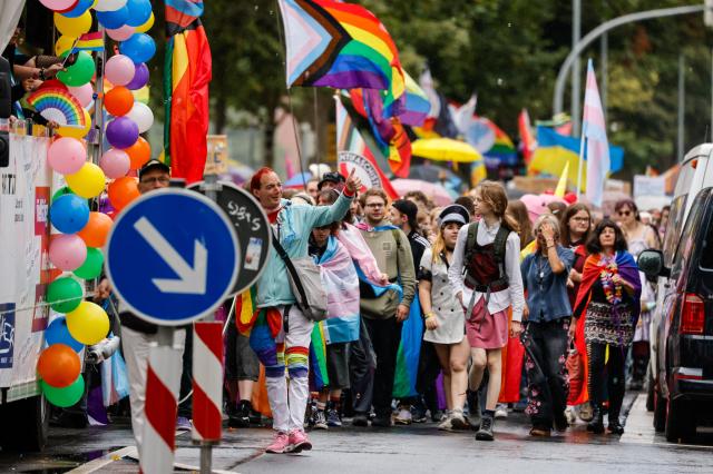22 August 2026, Bremen: Participants in the Christopher Street Day (CSD) parade walk along Sielwall. Photo: Focke Strangmann/dpa