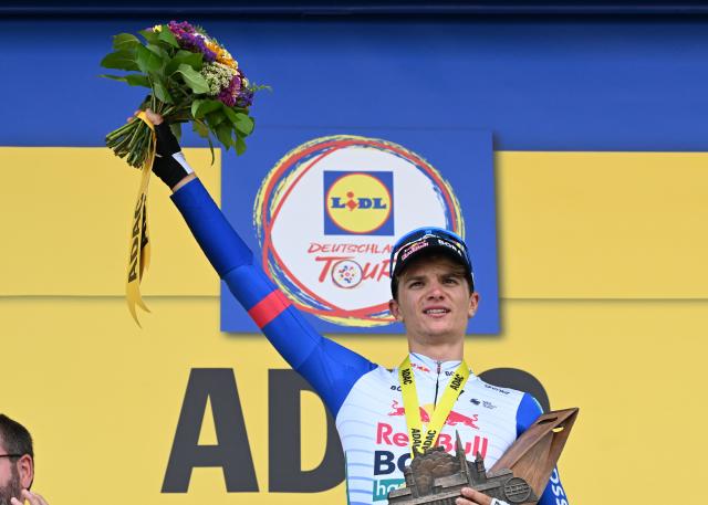 22 August 2026, Bad Duerkheim: Italian cyclist Giulio Pellizzari of team Red Bull-Bora-Hansgrohe celebrates on the podium after winning the third stage of the Tour of Germany cycling race, 169.70 km from Herxheim to Bad Duerkheim. Photo: Uli Deck/dpa