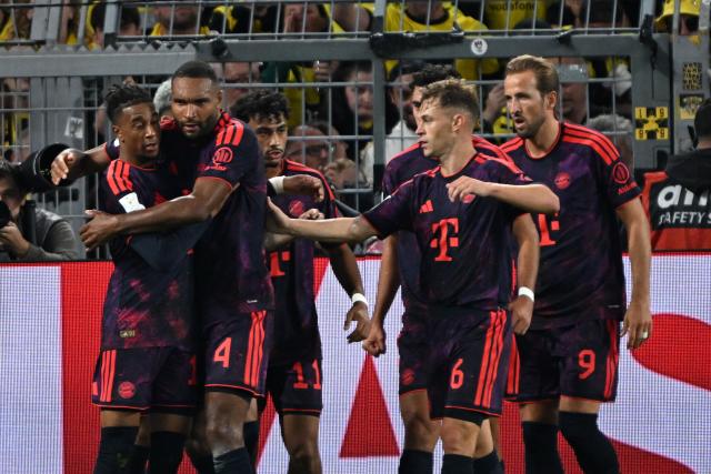 22 August 2026, Dortmund: Bayern Munich's Michael Olise celebrates scoring his side's 
second goal with teammates during the German Franz Beckenbauer Supercup soccer match between Borussia Dortmund and FC Bayern Munich at the Signal Iduna Park. Photo: Federico Gambarini/dpa - IMPORTANT NOTICE: Bundesliga and DFB regulations prohibit any use of photographs as image sequences and/or quasi-video.