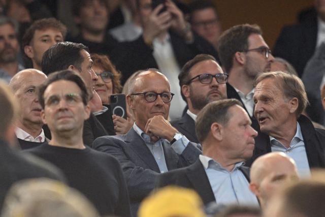 22 August 2026, Dortmund: German Chancellor Friedrich Merz attends the German Franz Beckenbauer Supercup soccer match between Borussia Dortmund and FC Bayern Munich at the Signal Iduna Park. Photo: Bernd Thissen/dpa - IMPORTANT NOTICE: Bundesliga and DFB regulations prohibit any use of photographs as image sequences and/or quasi-video.
