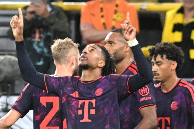 22 August 2026, Dortmund: Bayern Munich's Michael Olise celebrates scoring his side's second goal with teammates during the Ger
man Franz Beckenbauer Supercup soccer match between Borussia Dortmund and FC Bayern Munich at the Signal Iduna Park. Photo: Bernd Thissen/dpa - IMPORTANT NOTICE: Bundesliga and DFB regulations prohibit any use of photographs as image sequences and/or quasi-video.