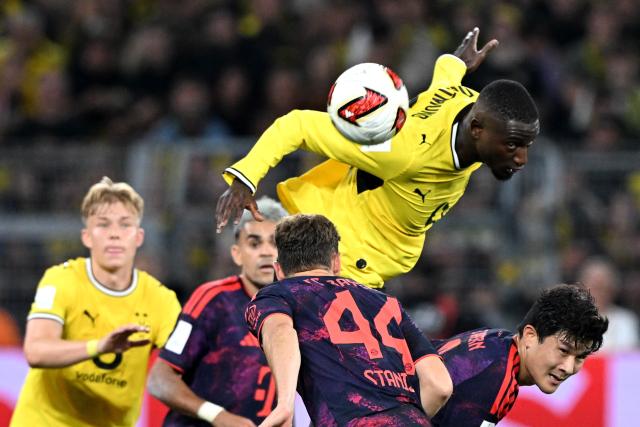 22 August 2026, Dortmund: Borussia Dortmund's Serhou Guirassy leaps to head the ball during the German Franz Beckenbauer Supercup soccer match between Borussia Dortmund and FC Bayern Munich at the Signal Iduna Park. Photo: Federico Gambarini/dpa - IMPORTANT NOTICE: Bundesliga and DFB regulations prohibit any use of photographs as image sequences and/or quasi-video.