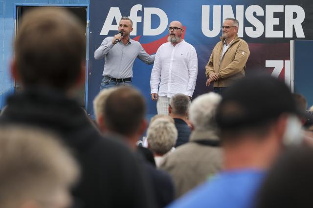21 August 2026, Saxony-Anhalt, Querfurt: Ulrich Siegmund (L-R), the AfD's lead candidate for the state election in Saxony-Anhalt; Hans-Thomas Tillschneider, the party's candidate for the state election; and Martin Reichardt, state chairman of the AfD in Saxony-Anhalt, stand together on stage at the party's family festival. Photo: Jan Woitas/dpa