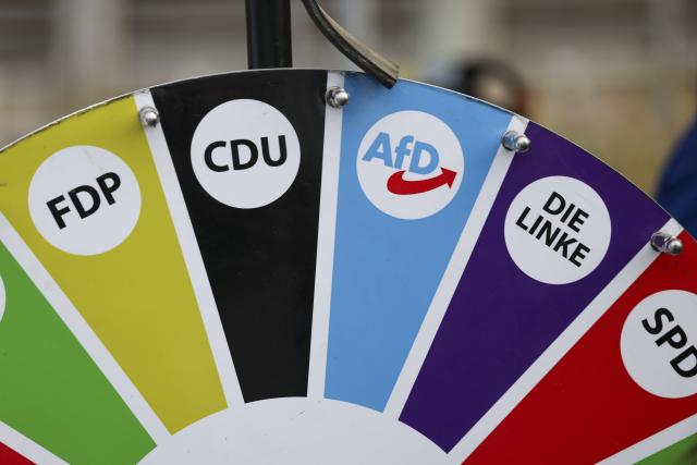 21 August 2026, Saxony-Anhalt, Querfurt: A wheel of fortune featuring all the political parties and the AfD logo in the center is being spun at one of the party's information booths for the state election in Saxony-Anhalt. Photo: Jan Woitas/dpa