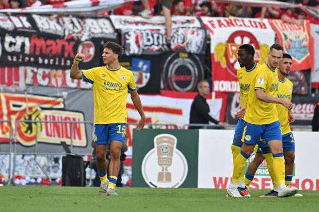 23 August 2026, Lower Saxony, Braunschweig: Eintracht Braunschweig's Max Marie (L) celebrates scoring his side's first goal during the German DFB Cup first round soccer match between Eintracht Braunschweig and 1. FC Union Berlin at Eintracht Stadium. Photo: Swen Pförtner/dpa