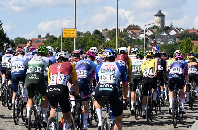 23 August 2026, Heilbronn: Cylcists ride during the fourth stage of the Tour of Germany cycling race, 156.5 km from Heilbronn to Heilbronn. Photo: Uli Deck/dpa