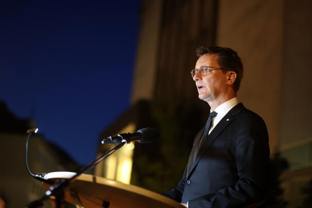 23 August 2026, North Rhine-Westphalia, Solingen: Minister President of North Rhine-Westphalia Hendrik Wuest speaks in front of the Stadtkirche during a memorial service for the victims of the Islamist terrorist attack two years ago, which left three people dead and many injured. Photo: Christoph Reichwein/dpa