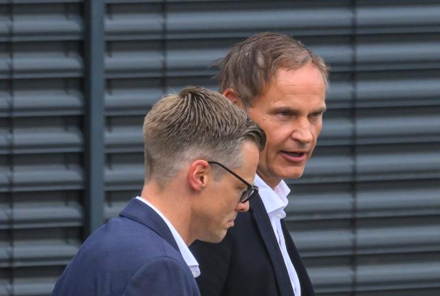 26 August 2026, Saxony, Zwickau: Volkswagen CEO Oliver Blume (R) leaves the VW plant in Zwickau alongside Danny Auerswald, spokesperson for the management board of Volkswagen Saxony. The automaker's CEO visited the Saxony plant this afternoon amid the dispute over new cost-cutting measures. Photo: Hendrik Schmidt/dpa