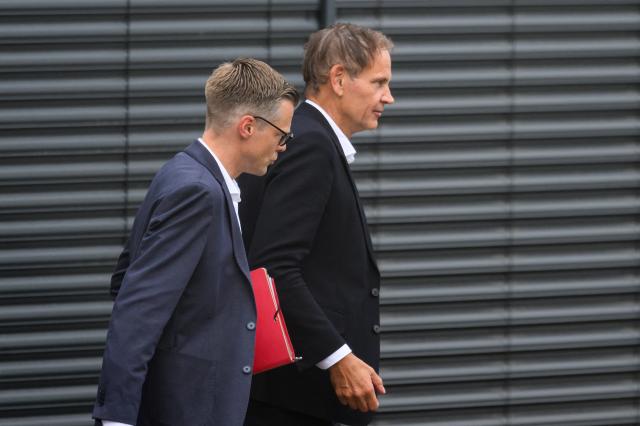 26 August 2026, Saxony, Zwickau: Volkswagen CEO Oliver Blume (R) leaves the VW plant in Zwickau alongside Danny Auerswald, spokesperson for the management board of Volkswagen Saxony. The automaker's CEO visited the Saxony plant this afternoon amid the dispute over new cost-cutting measures. Photo: Hendrik Schmidt/dpa