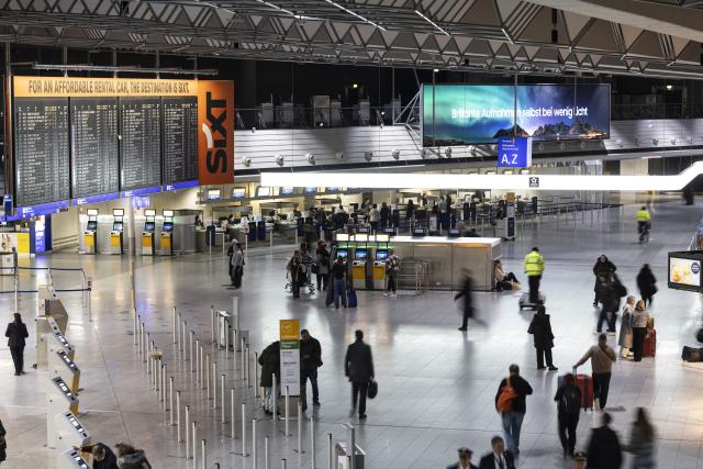 FILED - 04 February 2026, Hesse, Frankfurt/Main: FILE PHOTO - People walk through the departure hall at Frankfurt Airport. Photo: Hannes P Albert/dpa