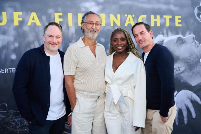 26 August 2026, Berlin: (L-R) German actor Martin Stange, Turkish-German actor Ercan Durmaz, British dancer Nikeata Thompson and German actor Soenke Moehring pose on the terrace of the Bertelsmann Foundation for the opening of the UFA Film Nights. Photo: Annette Riedl/dpa