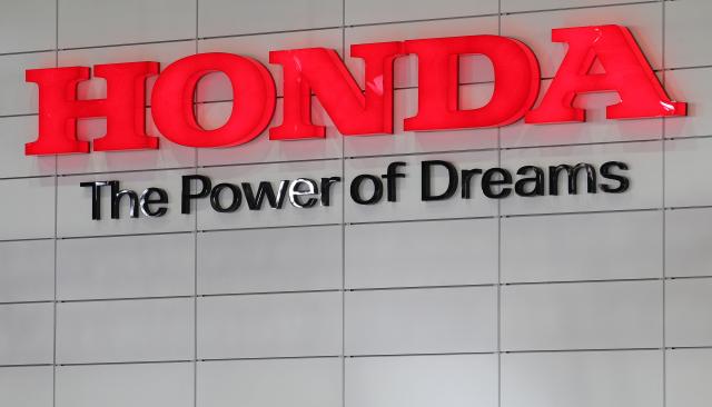 FILED - 14 April 2010, Saxony, Leipzig: FILE PHOTO - Honda Motor Company's logo is pictured during the Auto Mobil International (AMI) motor show in Leipzig. Photo: Jan Woitas/zb/dpa