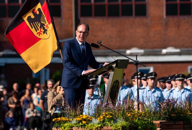 27 August 2026, Schleswig-Holstein, Lübeck: Alexander Dobrindt (C), German Minister of the Interior, speaks at the graduation ceremony for the 80th class of students from the Federal Police Academy, marking the completion of their studies, on the grounds of the Federal Police Academy. Photo: Daniel Bockwoldt/dpa