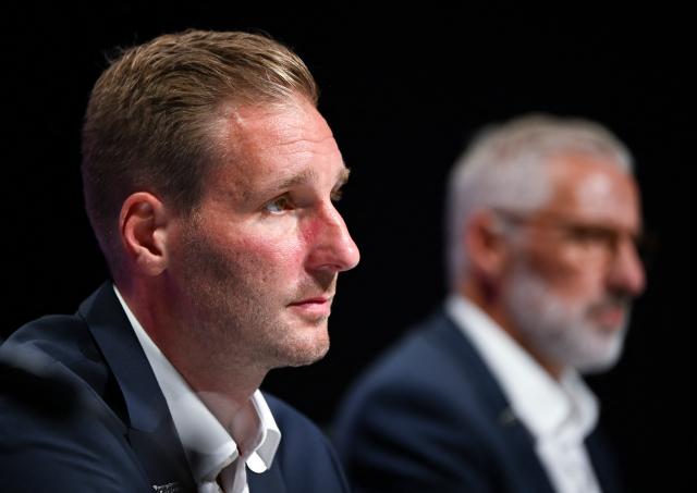 27 August 2026, Bavaria, Munich: Andre Rankel (L), the new head coach of the German national ice hockey team, and Christian Kuenast, sports director of the German Ice Hockey Federation, attend a press conference at the SAP Garden during Rankel's introductory presentation. Photo: Sven Hoppe/dpa