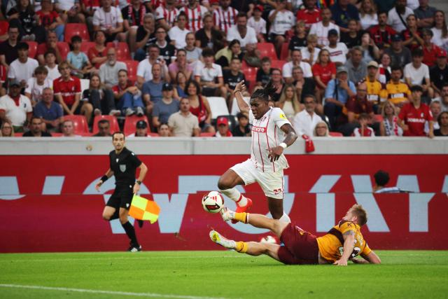 27 August 2026, Baden-Wuerttemberg, Freiburg im Breisgau: Motherwell's Ewan Wilson (R) slides into Freiburg's Cyriaque Irie during the UEFA Europa Conference League Round 4 Second Leg soccer match between SC Freiburg and FC Motherwell at Europa-Park Stadium. Photo: Philipp von Ditfurth/dpa
