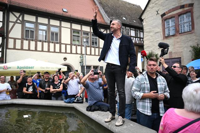 28 August 2026, Saxony-Anhalt, Sangerhausen: Ulrich Siegmund, the AfD's lead candidate in Saxony-Anhalt, addresses visitors at an AfD campaign booth from a fountain in the market square in Sangerhausen. The AfD is leading in the polls for the state election. Voters in Saxony-Anhalt will elect a new state legislature on September 6. Photo: Hendrik Schmidt/dpa - Standard Right of Use