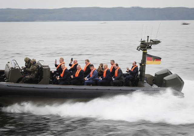 28 August 2026, Schleswig-Holstein, Flensburg: German Minister of the Interior Alexander Dobrindt, Parliamentary State Secretary to the Federal Minister of the Interior Christoph de Vries and the ministers and state secretaries of the Baltic Sea riparian states, take part in a ride on a Federal Police patrol boat as part of a visit to the patrol vessel "BP 82 Bamberg" during the Baltic Sea Security Summit at the Muerwik Naval Academy. Photo: Christian Charisius/dpa-Pool/dpa