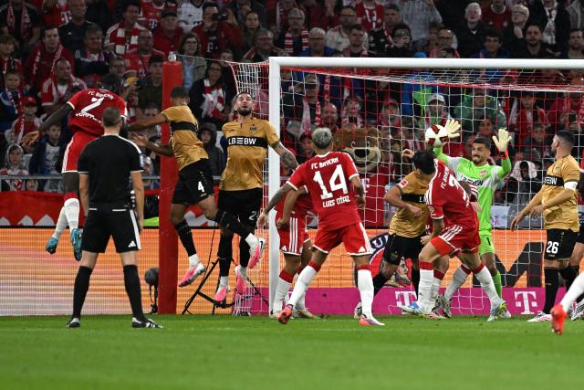 28 August 2026, Bavaria, Munich: Bayern Munich's Dayot Upamecano (L) scores his side's first goal during the German Bundesliga soccer match between FC Bayern Munich and VfB Stuttgart at Allianz Arena. Photo: Sven Hoppe/dpa - WICHTIGER HINWEIS: Gemäß den Vorgaben der Bundesliga bzw. des DFB Deutscher Fußball-Bund ist es untersagt, in dem Stadion und/oder vom Spiel angefertigte Fotoaufnahmen in Form von Sequenzbildern und/oder videoähnlichen Fotostrecken zu verwerten bzw. verwerten zu lassen.