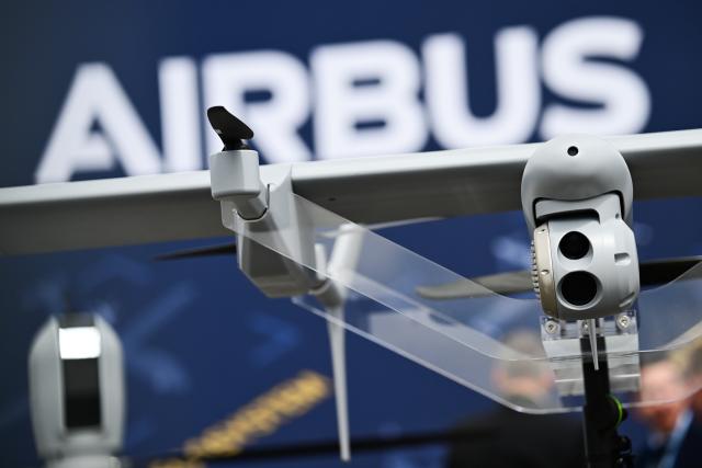 FILED - 12 June 2026, Brandenburg, Schoenefeld: The "Airbus" logo can be seen behind a drone at the Berlin ExpoCenter Airport during the International Aerospace Exhibition (ILA). Photo: Sebastian Gollnow/dpa