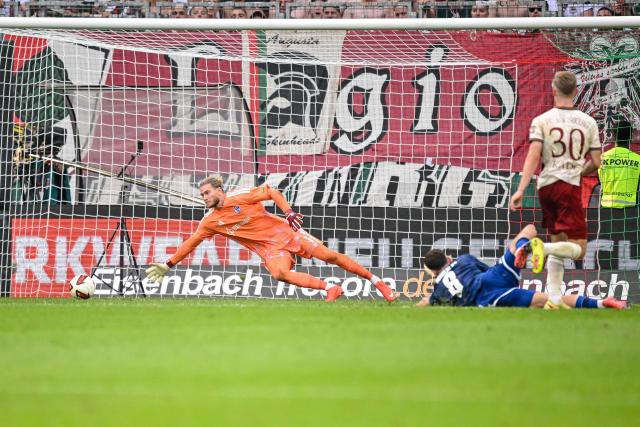 30 August 2026, Bavaria, Augsburg: Augsburg's Anton Kade scores his side's second goal during the German Bundesliga soccer match between FC Augsburg and FC Schalke 04 at the WWK-Arena. Photo: Harry Langer/dpa - IMPORTANT NOTICE: Bundesliga and DFB regulations prohibit any use of photographs as image sequences and/or quasi-video.