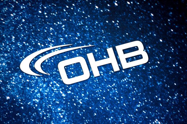 FILED - 20 March 2025, Bremen: FILE PHOTO - The OHB logo is seen on a billboard in Bremen. Photo: Sina Schuldt/dpa