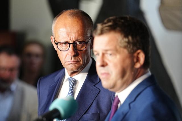 31 August 2026, Quedlinburg: German Chancellor Friedrich Merz and Sven Schulze, Minister-President of Saxony-Anhalt and lead candidate of the Christian Democratic Union (CDU), give a statement during the campaign leading up to the state election in Saxony-Anhalt. Photo: Kay Nietfeld/dpa