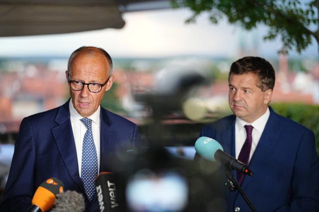 31 August 2026, Quedlinburg: German Chancellor Friedrich Merz and Sven Schulze, Minister-President of Saxony-Anhalt and lead candidate of the Christian Democratic Union (CDU), give a statement during the campaign leading up to the state election in Saxony-Anhalt. Photo: Kay Nietfeld/dpa
