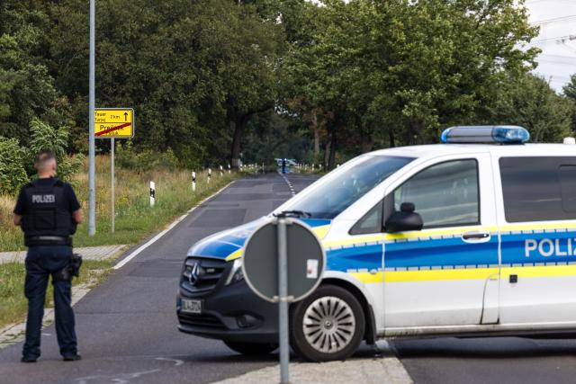 01 September 2026, Brandenburg, Turnow-Preilack: Police officers are blocking off the road leading to the substation. Unconventional explosive devices were found at the substation today. Photo: Frank Hammerschmidt/dpa