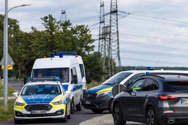 01 September 2026, Brandenburg, Turnow-Preilack: Police officers are blocking off the road leading to the substation. Unconventional explosive devices were found at the substation today. Photo: Frank Hammerschmidt/dpa