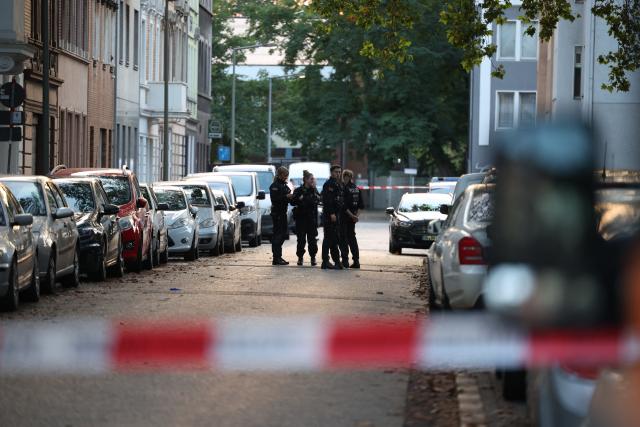 01 September 2026, North Rhine-Westphalia, Duisburg: Police officers secure the crime scene in front of St. Paul's Church after shots were fired during an altercation involving several people in Duisburg. Photo: Christoph Reichwein/dpa