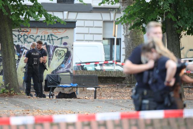 01 September 2026, North Rhine-Westphalia, Duisburg: Police officers secure the crime scene in front of St. Paul's Church after shots were fired during an altercation involving several people in Duisburg. Photo: Christoph Reichwein/dpa