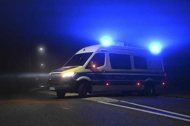 01 September 2026, Brandenburg, Turnow-Preilack: A police car is parked at the edge of Preilack, blocking the road. Unconventional explosive devices were found today at the nearby substation. Photo: Markus Lenhardt/dpa