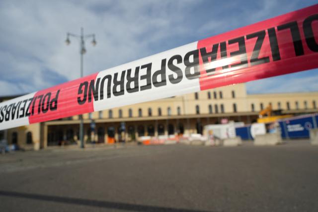 02 September 2026, Bavaria, Augsburg: A Police barrier tape is set up to block access to the main train station in Augsburg, following an explosion near the station, police found a suspicious object. According to police, access to the station is currently completely blocked off, and train service has also been suspended. Photo: Felix Kirberg/dpa