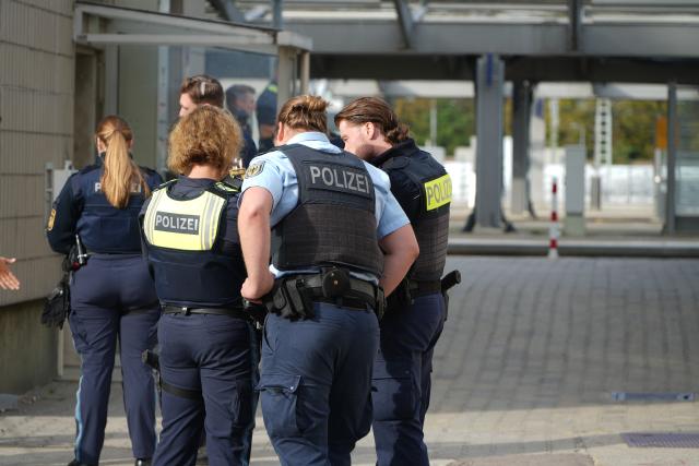 02 September 2026, Bavaria, Augsburg: Police officers are stationed near the the main train station in Augsburg, following an explosion near the station. Police have found a suspicious object. According to police, access to the station is currently completely blocked off, and train service has also been suspended. Photo: Felix Kirberg/dpa